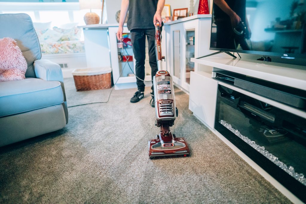 man using a carpet cleaner